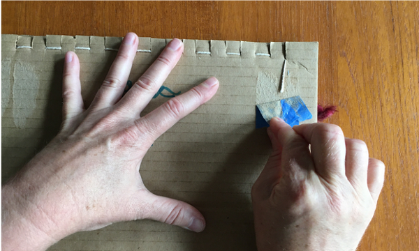 Removing tape from the back of the loom
