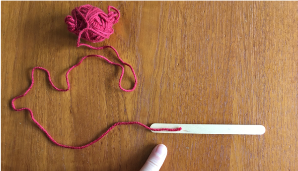 Attaching yarn to popsicle stick