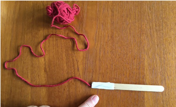 Taped end of popsicle stick