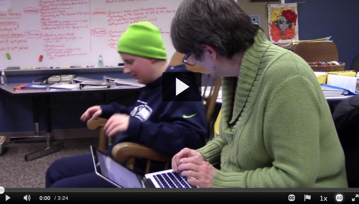 A boy tells a story with Linda on her laptop