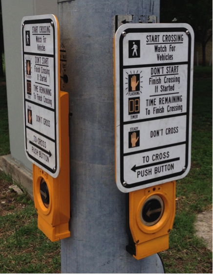 APS with vibro tactile button that includes raised arrow in direction of travel, speech output, and information sign in print